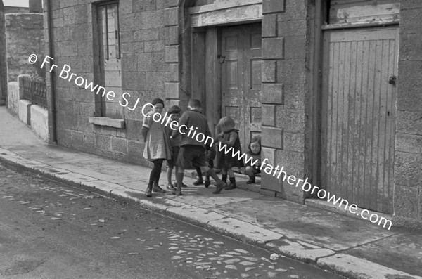 CHILDREN PLAYING IN STREET